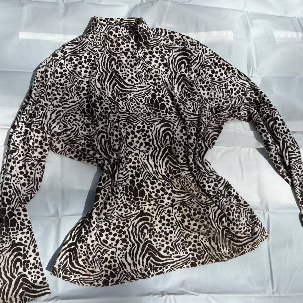 Kim Rogers Black and cream turtle neck top